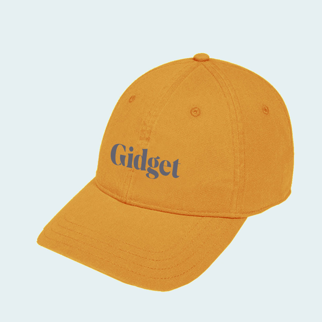 Women's golden hour colored dad-hat with print of g-fin logo