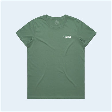 Women's sage colored t-shirt, view of front-side, with small print of g-fin logo